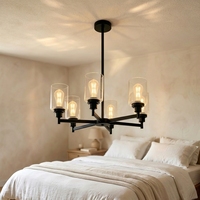 Lustre de style farmhouse à 6 lumières, structure en métal noir avec bras croisés, abat-jour cylindriques en verre transparent, luminaire de plafond avec douille E26