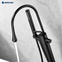 Robinet de baignoire sur pied en laiton avec mitigeur chaud/froid et douchette à main pour salle de bain moderne