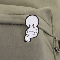 Broche en métal contrastante avec figurine doodle simple assise, visage souriant et larmes bleues, style art meme pour la culture des memes
