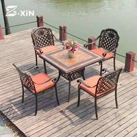 Ensemble table et chaises de salle à manger d'extérieur en fonte d'aluminium de haute qualité, résistant aux UV et imperméable pour les restaurants de jardin de loisirs