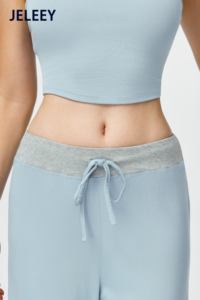 Matching set featuring a sports vest and loose-fitting, straight-leg <b>trousers</b> with an adjustable <b>drawstring</b>. - Product Image 6