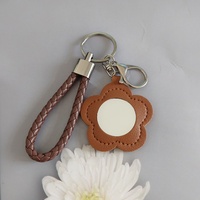 Porte-clés miroir compact en cuir PU créatif et tendance, avec motif floral, pochette à rouge à lèvres portable, miroir de maquillage, joli pendentif de sac