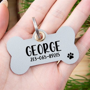 Etiquetas de identificación de perro de cuero portátil Etiquetas de nombre de perro con forma de hueso de PU Etiquetas de collar de mascota en blanco - Product Image 3
