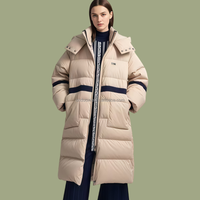 Vestes matelassées OEM personnalisées en duvet de canard blanc à 90 %, manteaux pour femmes à capuche avec décor rayé, style sportif, longs et amples, pour l'hiver