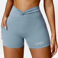 Shorts de sport pour femmes OEM avec logo personnalisé, taille haute torsadée, poches latérales pour téléphone, effet ventre plat et rehaussement des fesses, pour yoga, course à pied et cyclisme
