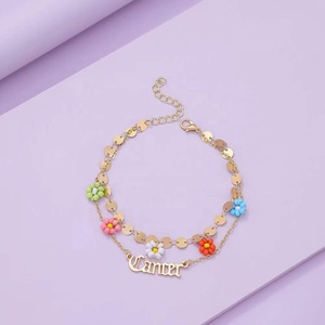 Gaby – bracelets de cheville colorés fleur pendante, bracelet de plage de pied avec double chaîne, bracelet de cheville zodiaque pour femmes, vente en gros, bijoux de corps - Product Image 2