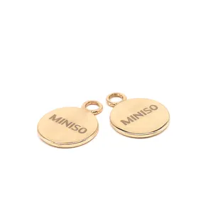 Yüksek kaliteli promosyon yuvarlak şekil altın kaplama sikke Metal logosu kazınmış altın kolye metal takı etiketleri takılar için