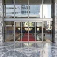 Porte en verre sans cadre à ressorts au sol, double action, à battant libre, pour entrée commerciale