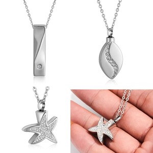 Collier commémoratif en acier inoxydable avec pendentif urne torsadé en forme d'étoile et de goutte d'eau, orné de strass, pour cendres funéraires - Product Image 1