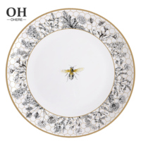 Nouvel arrivage Ensemble de vaisselle de mariage en porcelaine osseuse écologique de luxe Assiette de chargeur au design en nid d'abeille Assiette latérale Assiettes à vaisselle pour