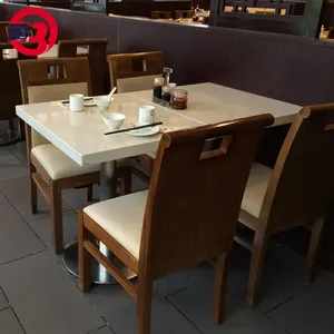 सफेद संगमरमर वर्ग रेस्तरां तालिका में शीर्ष दो लोगों के लिए सीट