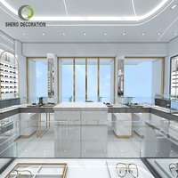 Vitrine d'exposition de lunettes optiques LED personnalisée avec étagères murales en bois et éclairage LED pour le rangement des lunettes