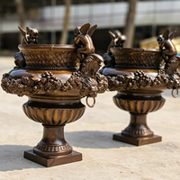 Macetero Urna de Bronce Fundido Grande Personalizado con Ángel Querubín para Jardín y Proyectos Hoteleros, Estatua Clásica Ornamentada para Macetas, Fabricante
