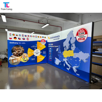 Ensemble de stand d'exposition modulaire portable bleu, vert et blanc avec murs d'affichage 3 faces et comptoir de réception pour animaux de compagnie