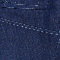 Veste de travail pour homme en denim brut indigo moyen, coupe décontractée et ample, avec quatre grandes poches plaquées, bords selvedge et boutons argentés