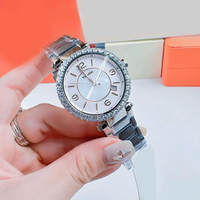 Montre élégante pour femmes, boîtier rond en cristal, cadran en nacre, date, bracelet en acier inoxydable, lunette en strass, montre-bracelet pour dames