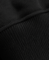 Sudadera con capucha negra de algodón grueso con cremallera completa, logotipo personalizado, hombros caídos, estilo oversize, bolsillo canguro y puños acanalados.
