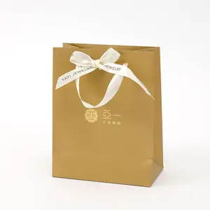 白色纸板金色礼品服装购物手提包定制珠宝艺术定制纸袋丝带棕色
