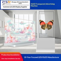 Écran OLED transparent de 55 pouces sur pied blanc, pas de pixel de 0,88 mm, machine publicitaire de bureau pour hall d'exposition commercial