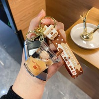 2025 nouveau mignon acrylique porte-clés porte-clés ours huile flottant petit ours bulle boba sables mouvants lait thé tasse liquide porte-clés jouet