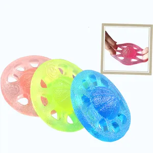 Produits de vente chauds TPR couleurs personnalisées trous de main disque décompression balle de Massage jouets pour enfants