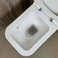 WC suspendu sans bride à chasse d'eau en spirale, avec fonction vortex, et tapis sanitaire pour lavabo.