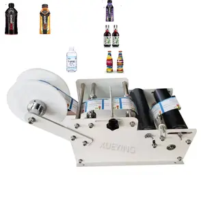 Manual Mineral Water Plastic Round Bottle Labeling Machine For Round Bottles Sticker Label Packing Machine