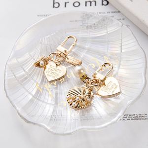 Elegant Letter Label Women Girls Pearls <b>Key</b> <b>Chain</b> Handbag Hanging Pendant Keyring Heart Shell Pendant Keychain - Product Image 3