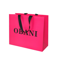 Conception personnalisée écologique de luxe en noir et blanc pour la vente au détail de sacs en papier épais impression laminée pour le shopping emballage cadeau pour vêtements