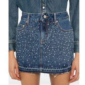 Falda vaquera de verano con diamantes de imitación, diseño OEM, nueva, para mujer, color índigo, minifalda de algodón - Product Image 1