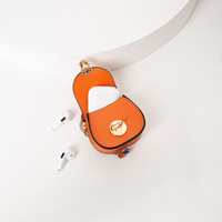 Mini sac à dos en cuir pour femme, porte-clés, petite pochette à monnaie, motif cercle, bouton-pression, avec breloques pour clés et écouteurs