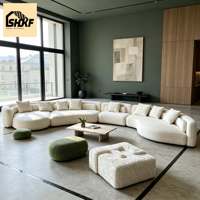 Canapé modulaire en bouclettes courbées, design modulaire, coussins texturés, silhouette arrondie, salon, villa, intérieurs d'hôtellerie