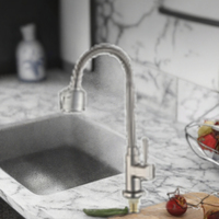 Robinet de lavabo monocommande monotrou en alliage de zinc brossé, à ouverture rapide, avec cartouche céramique, pour montage sur plan.