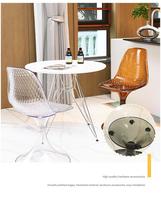 Chaise de salle à manger moderne en acrylique intégré transparent ambre, avec accoudoirs incurvés et dossier ergonomique, design coquille, pour la maison et le bureau