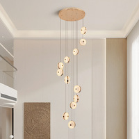 Luminaires suspendus ronds à LED de luxe pour hall de villa, salon, et lustres modernes à double hauteur pour escalier