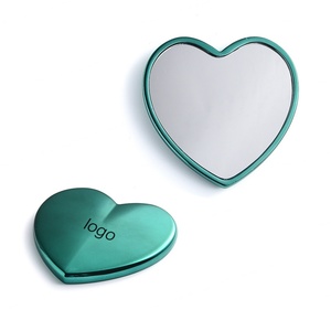 Wholesale Heart Shape Green Engraved Laser Metal Pocket <b>Compact</b> Makeup Handbag <b>Mirrors</b> - Product Image 1