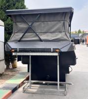 Caravane tout-terrain moderne et légère en aluminium de luxe avec tente de toit escamotable pour pick-up, grand espace de couchage RV