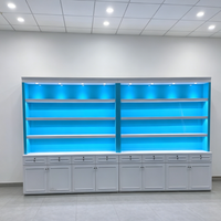 Étagère de présentation moderne avec rétroéclairage LED bleu, vitrine multi-niveaux avec base verrouillable pour produits de tabac/produits pharmaceutiques