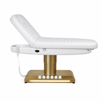 Cama de belleza eléctrica de 3 motores con columna dorada cepillada, base de luz LED cálida, orificio facial, para terapia, salón, spa, microblading, clínica