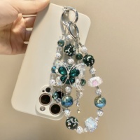 Breloque de téléphone papillon vert foncé ornée de strass et de perles, pendentif de sac artisanal lourd, cordon de poignet, ornement pour femme, cadeau