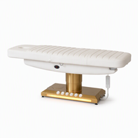 Cama de belleza eléctrica de 3 motores con columna dorada cepillada, base de luz LED cálida, orificio facial, para terapia, salón, spa, microblading, clínica