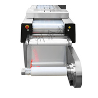 Machine d'emballage sous vide entièrement automatique pour film étirable haute résistance continu |   Gâteau braisé aux pieds de poulet et à la peau de tofu grande capacité