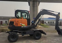 Machinerie de terrassement : Mini-pelle sur roues 6 tonnes DX60W avec tarière, godet à pince, moteur, pompe et engrenages à haute efficacité