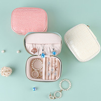 Vente en gros de boîte à bijoux en cuir PU avec fermeture éclair pour l'organisation de bijoux
