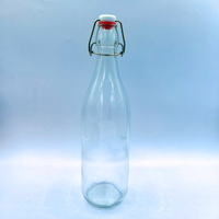 Botella de Vidrio Transparente Redonda de 1000 ml, 500 g, 1 L, Juego Completo a Precio Económico, con Tapa Abatible y Tapón Metálico
