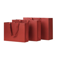 Bolsa de papel logotipo impreso personalizado ropa de lujo bolsas de papel de compras Boutique bolsa de papel de regalo reciclable con cuerda de cinta