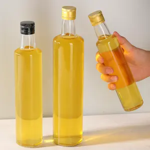 Vendita calda rotonda trasparente 250ml 500ml 750ml bottiglie di vetro con tappo in metallo per imballaggio di stoccaggio dell'olio di salsa di olio d'oliva spremuto a freddo