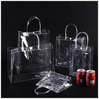 Sac fourre-tout transparent en PVC refermable avec fermeture éclair et poignées pour masques faciaux et cosmétiques, surface brillante portable