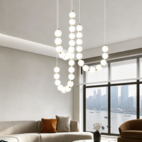 Lustre LED ovale long moderne et minimaliste personnalisé, luminaire suspendu de luxe à intensité variable et hauteur réglable pour hall d'hôtel et salon