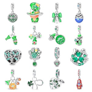 A green and white brass pendant featuring the classic four-leaf clover and heart motif, perfect for women - Product Image 1